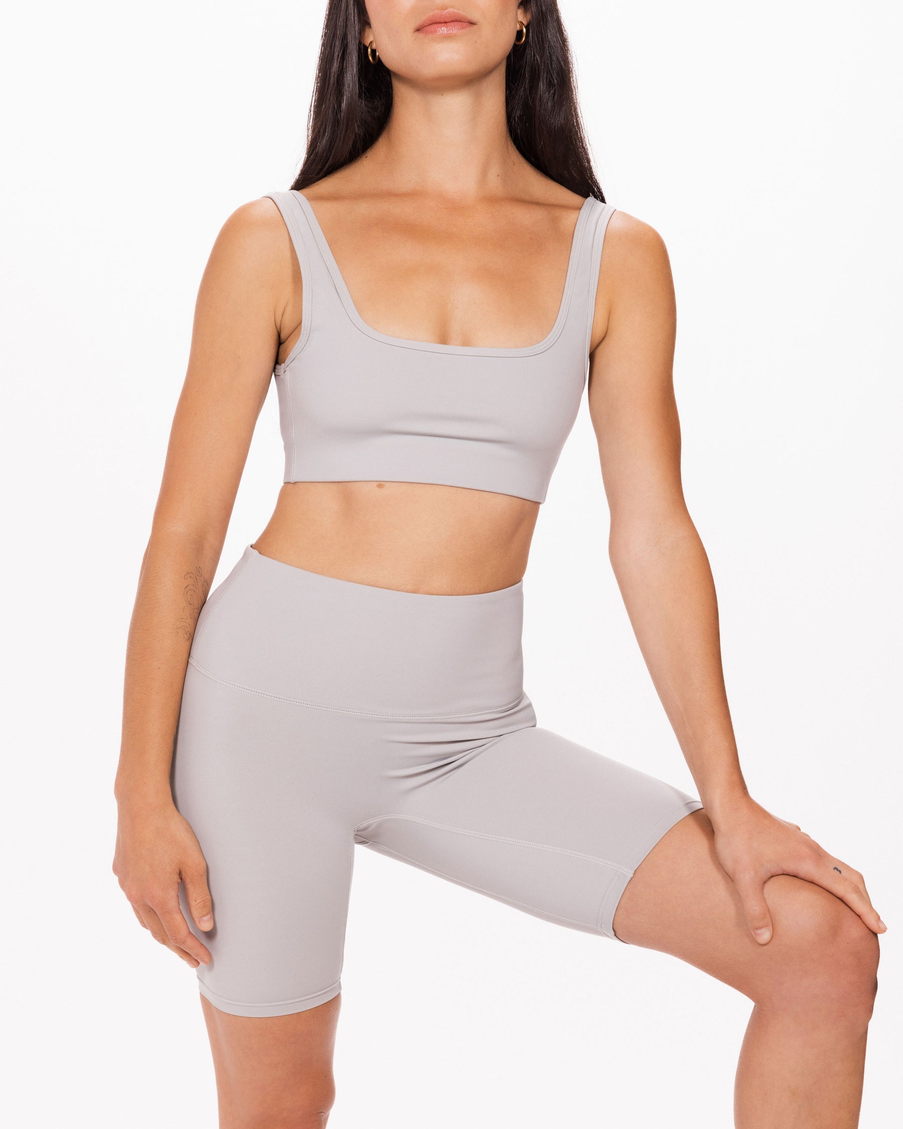 Women wearing Canadian made grey sports bra and bicycle shorts