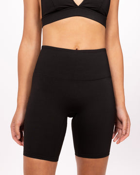 Front shot of a woman wearing black bicycle shorts made and designed in vancouver