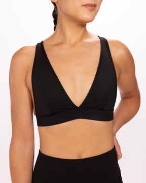 woman wearing deep v, black, adjustable bra